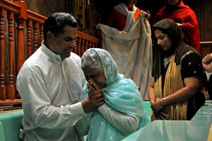 Baptism Pastor and wife performing the baptism together
